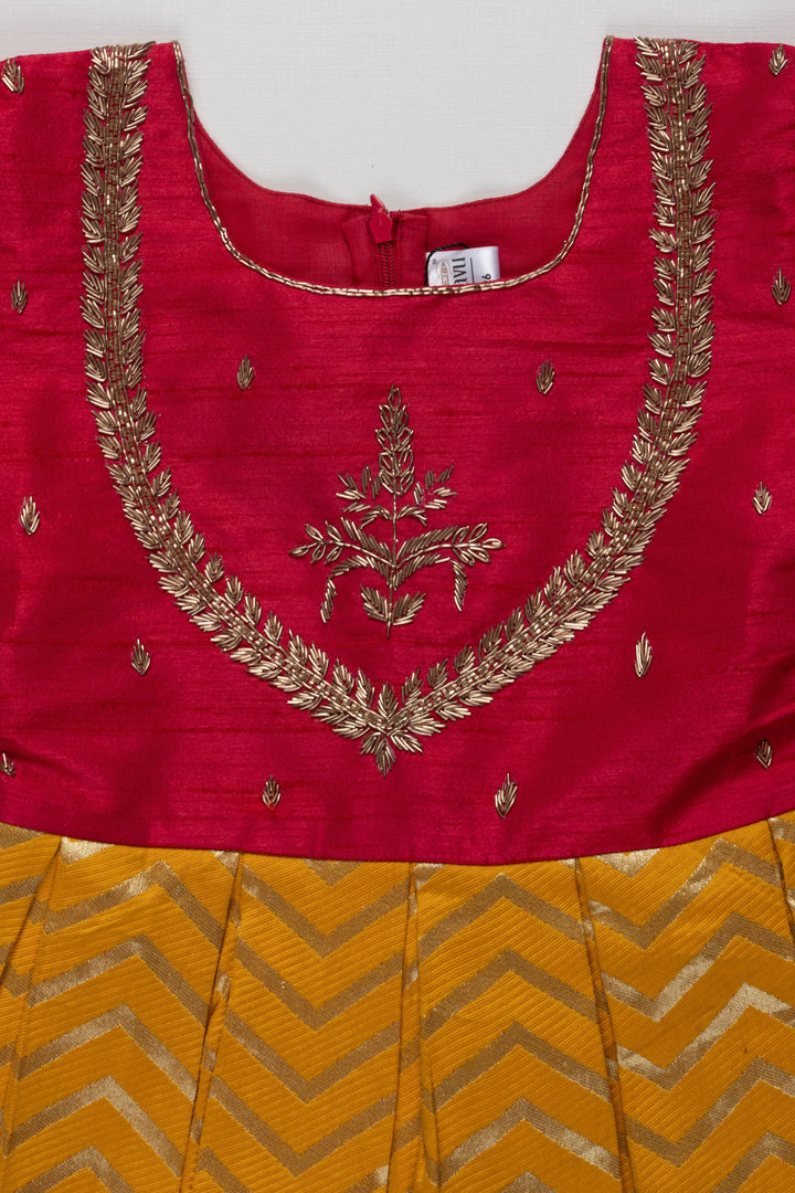 The Nesavu Silk Party Frock Majestic Maroon and Yellow Pattu Silk Frock: Intricate Gold Embroidery with Chevron for Girls Nesavu Maroon and Yellow Pattu Silk Frock | Chevron Pattern & Banarasi Border | Traditional Festive Wear for Girls | The Nesavu