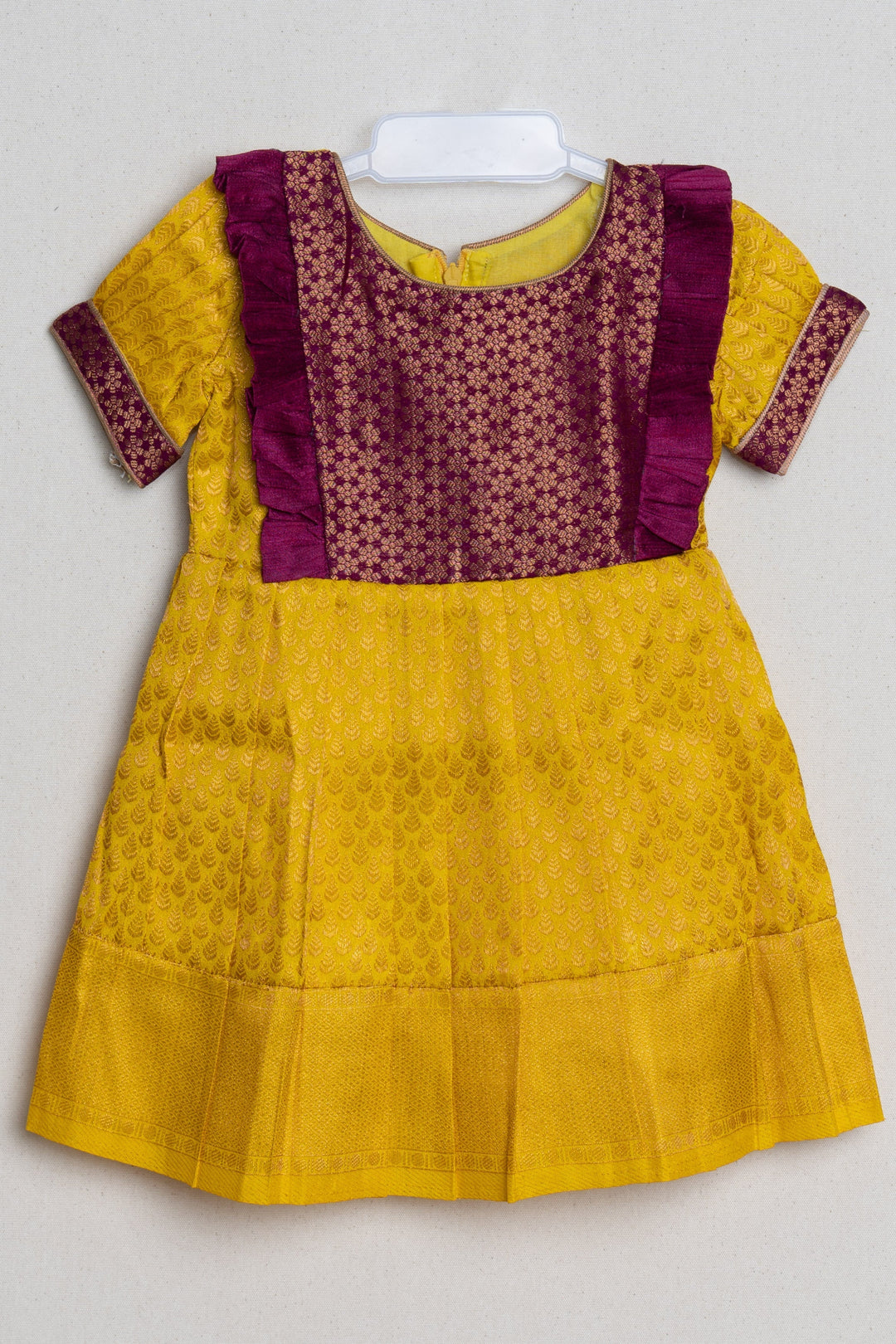 The Nesavu Girls Kanchi Silk Frock Mango Yellow with Deep Purple Semi Banarasi Silk / Pattu Frock for Kids Girls Nesavu Floral Purple and Yellow Semi-Silk Frock for Girls | The Nesavu