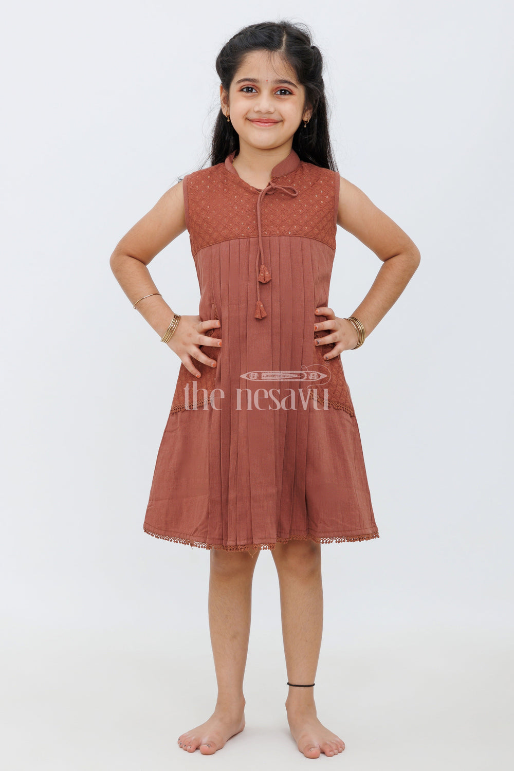 The Nesavu Girls Cotton Frock Maroon Cotton Frock with Center Box Pleats and Embroidered Yoke Line for Girls Nesavu Maroon Cotton Frock with Embroidered Yoke Line and Pleats for Girls Nesavu