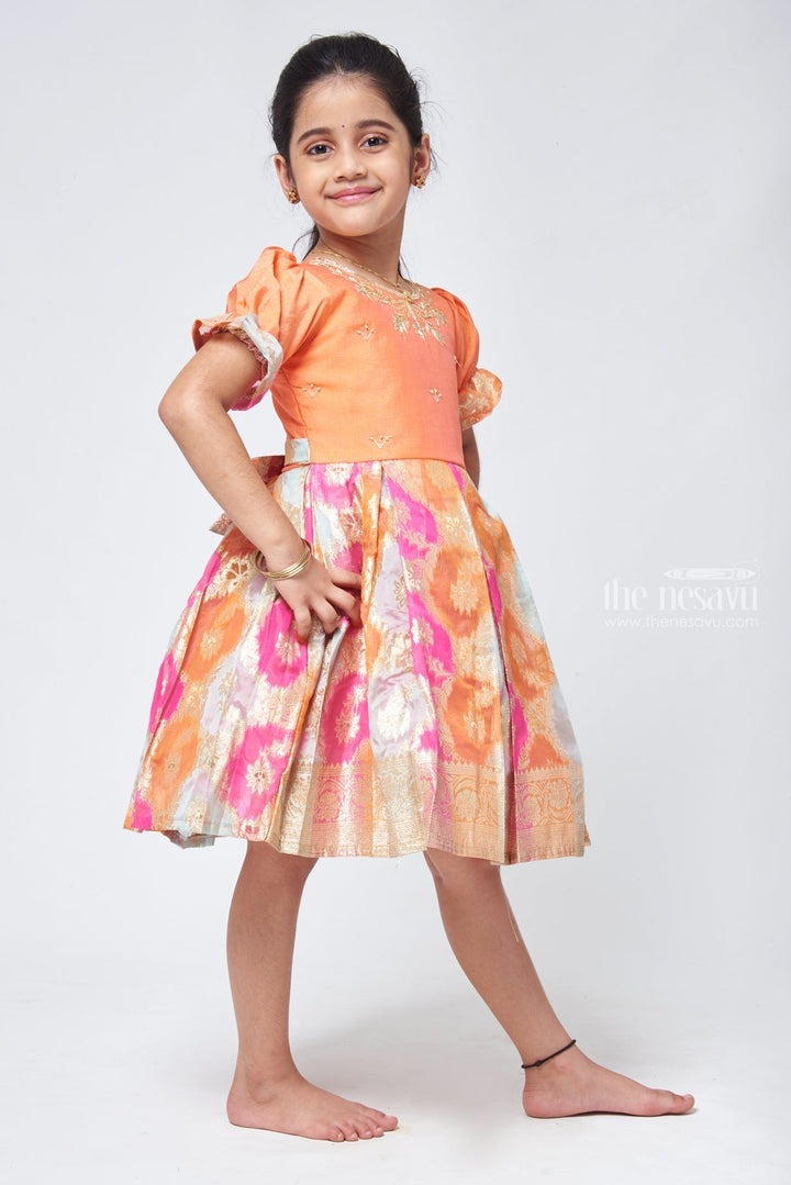 The Nesavu Silk Party Frock Mesmerizing Zari Embroidery on Pleated Kanchivaram Orange Ensemble Nesavu Pattu Frock For Little Girls | Girls Designer Silk Frock | The Nesavu