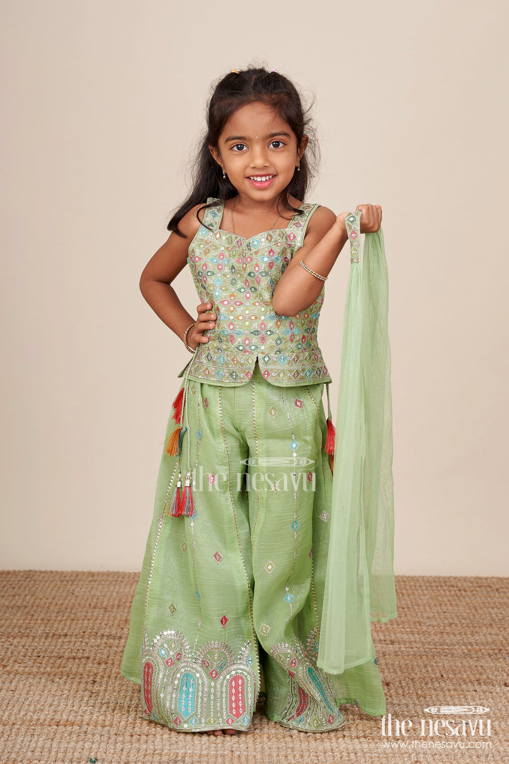 The Nesavu Girls Sharara / Plazo Set Mirror Embroidered Green Sharara Set with Colorful Tassels Nesavu Nesavu mirror embroidered georgette sharara set  girls festive ethnic wear