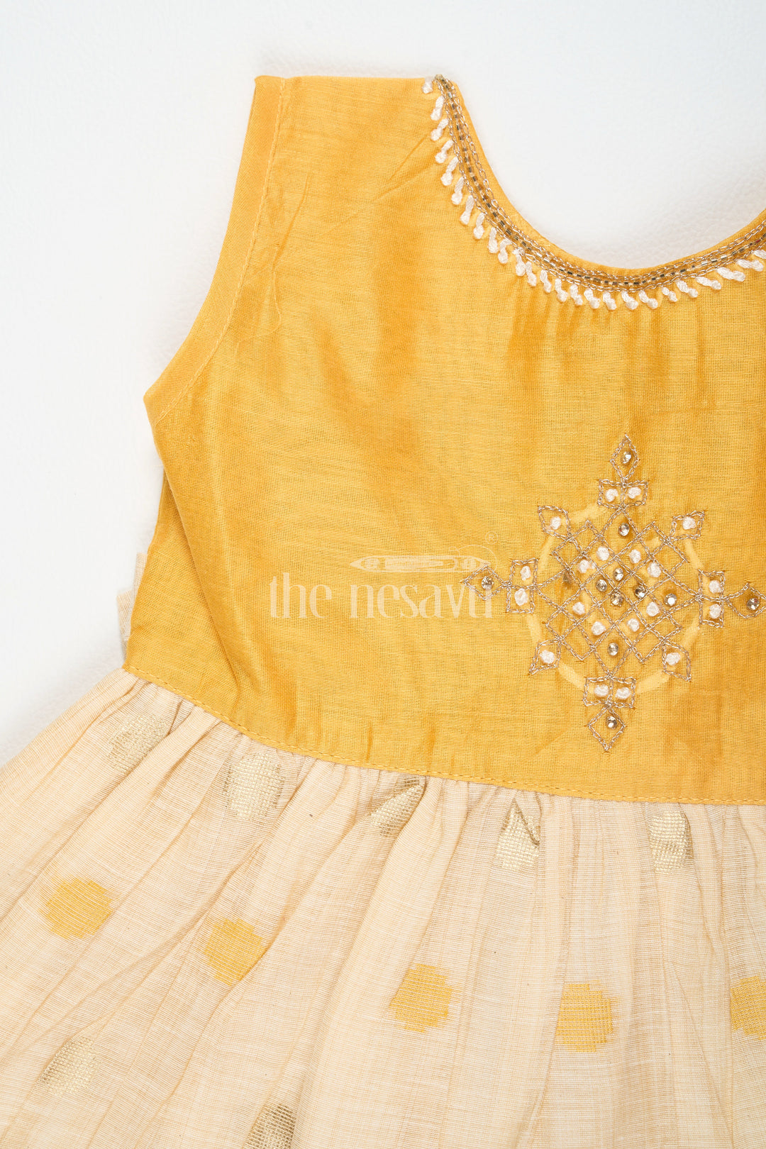 The Nesavu Girls Cotton Frock Mustard and Beige Chanderi Cotton Frock for Girls with Silver Beadwork and Polka Dot Details Nesavu Nesavu Girls Mustard Beige Chanderi Cotton Frock Silver Beadwork Polka Dot Skirt