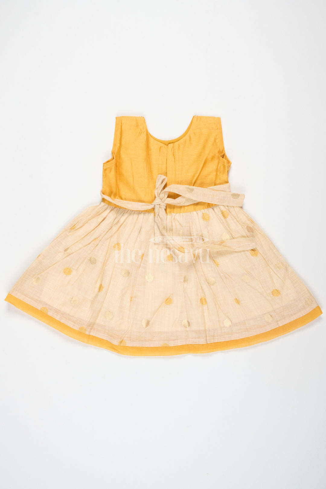 The Nesavu Girls Cotton Frock Mustard and Beige Chanderi Cotton Frock for Girls with Silver Beadwork and Polka Dot Details Nesavu Nesavu Girls Mustard Beige Chanderi Cotton Frock Silver Beadwork Polka Dot Skirt