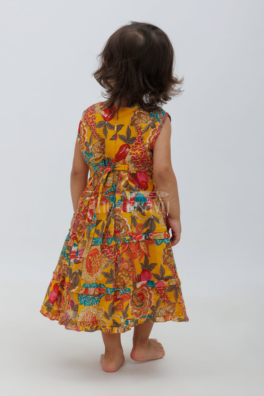 The Nesavu Baby Fancy Frock Mustard Blend Silk Frock with Peter Pan Collar and Floral Print Nesavu Mustard Blend Silk Frock with Peter Pan Collar and Floral Print - Nesavu