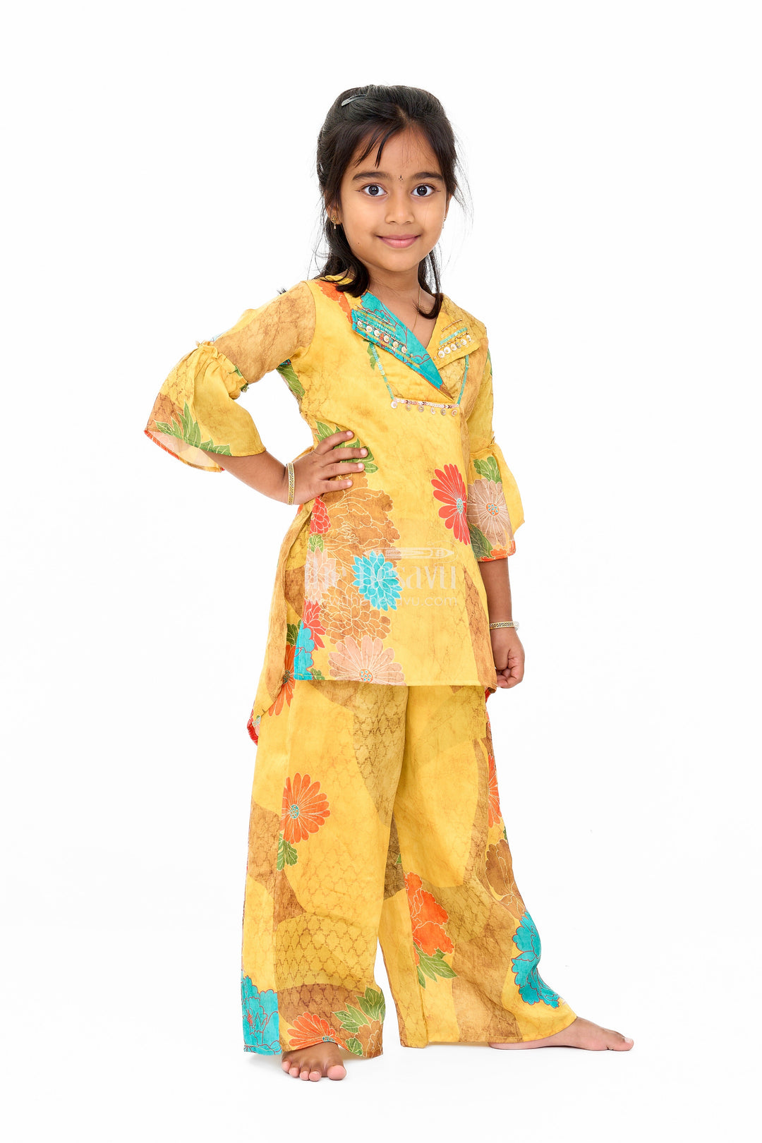 The Nesavu Girls Sharara / Plazo Set Mustard Mercerised Silk Cotton Girls Sharara Set with Bold Floral Print and Embellished Neckline Nesavu Nesavu Mustard Mercerised Silk Cotton Sharara Set Girls Floral Print Sequined Top