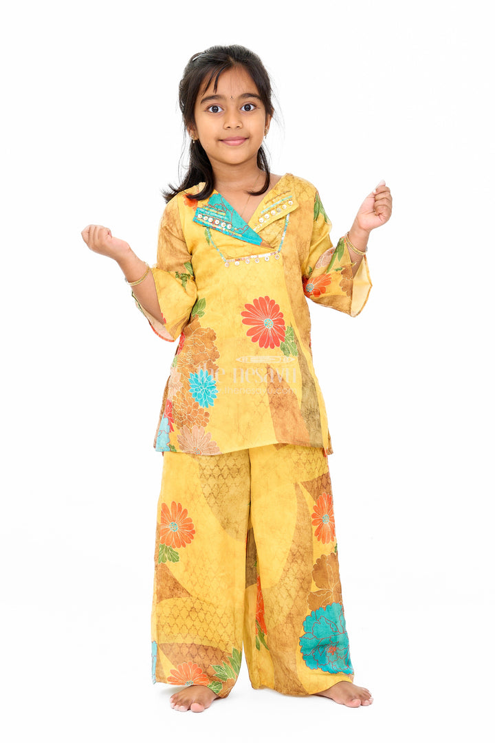 The Nesavu Girls Sharara / Plazo Set Mustard Mercerised Silk Cotton Girls Sharara Set with Bold Floral Print and Embellished Neckline Nesavu Nesavu Mustard Mercerised Silk Cotton Sharara Set Girls Floral Print Sequined Top