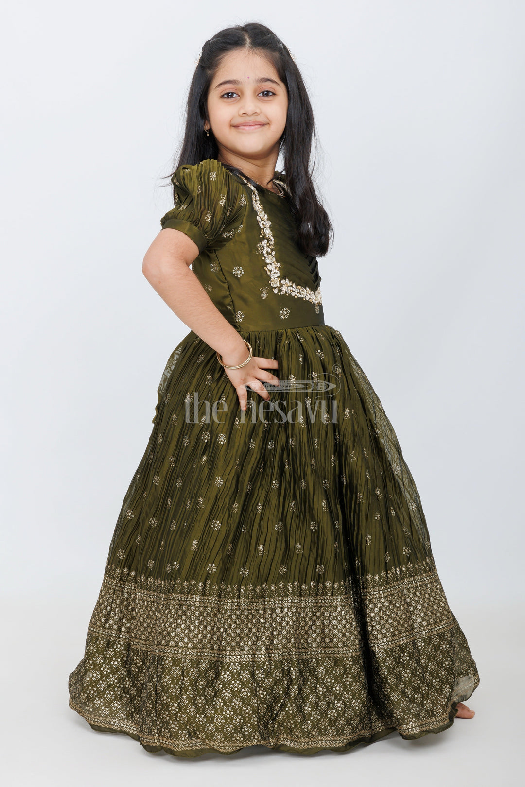 The Nesavu Girls Silk Gown Olive Green Girls Silk Gown with Foil Print and Puff Sleeves for Heavy Party Wear Nesavu Nesavu Olive Green Girls Party Gown Gold Embroidery Puff Sleeves Grand Occasions