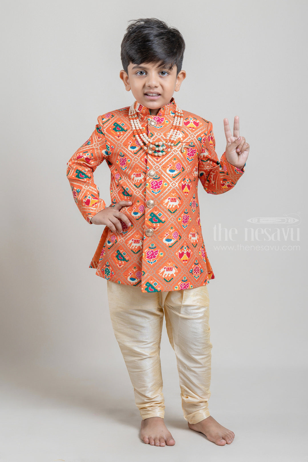 The Nesavu Boys Sherwani Orange All Over Animal Printed Boys Ethnic Kurta with White Dhoti and Beige Pant Nesavu 14 (6M) / Orange / Silk Blend BES347A Shop Orange All Over Animal Printed Boys Ethnic Kurta with White Dhoti and Beige Pant | Festive and Party Wear | The Nesavu