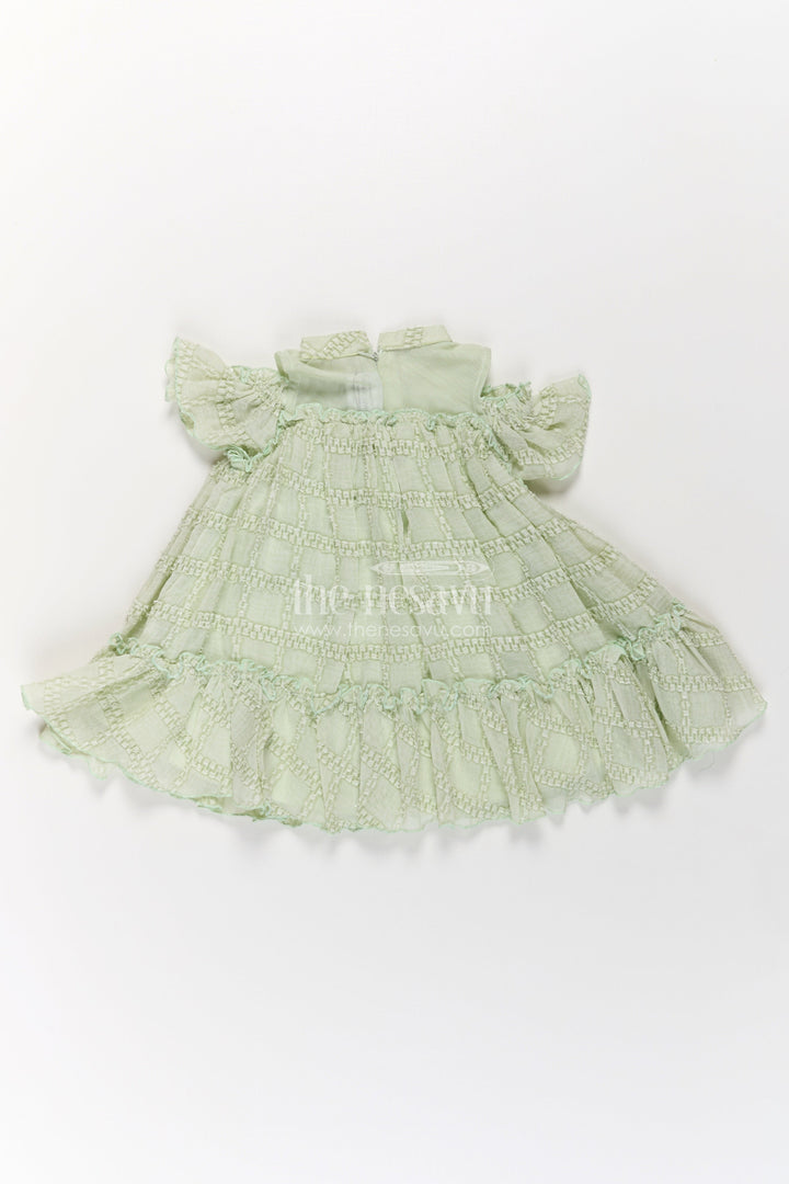 The Nesavu Girls Fancy Frock Organza Dress Frock for Girls in Light Green with Ruffle Hem and Floral Brooch Detail Nesavu Organza Dress Frock Girls Light Green Ruffles Embellished Floral Brooch | The Nesavu