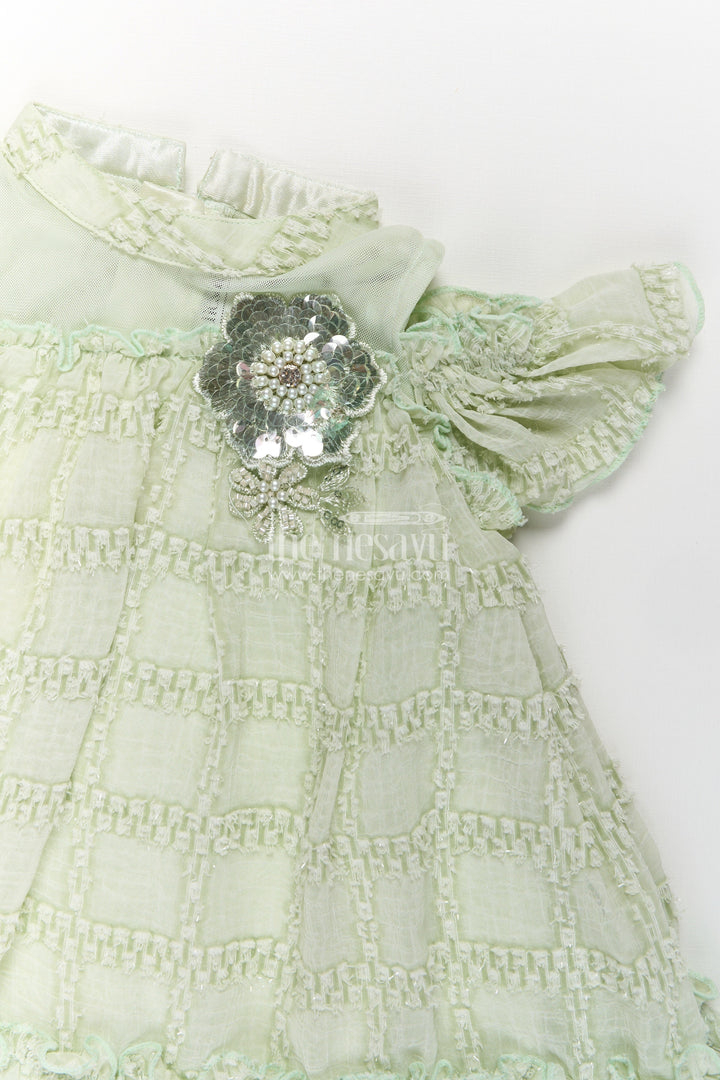 The Nesavu Girls Fancy Frock Organza Dress Frock for Girls in Light Green with Ruffle Hem and Floral Brooch Detail Nesavu Organza Dress Frock Girls Light Green Ruffles Embellished Floral Brooch | The Nesavu