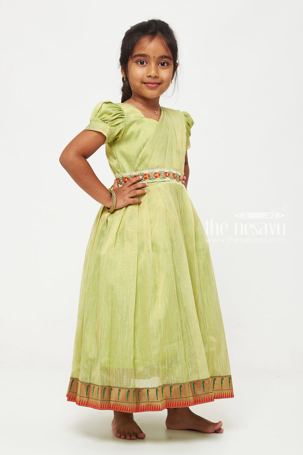 The Nesavu Girls Silk Gown Parrot Green Tissue Fabric Saree Gown for Girls with Embroidered Hip Belt Nesavu