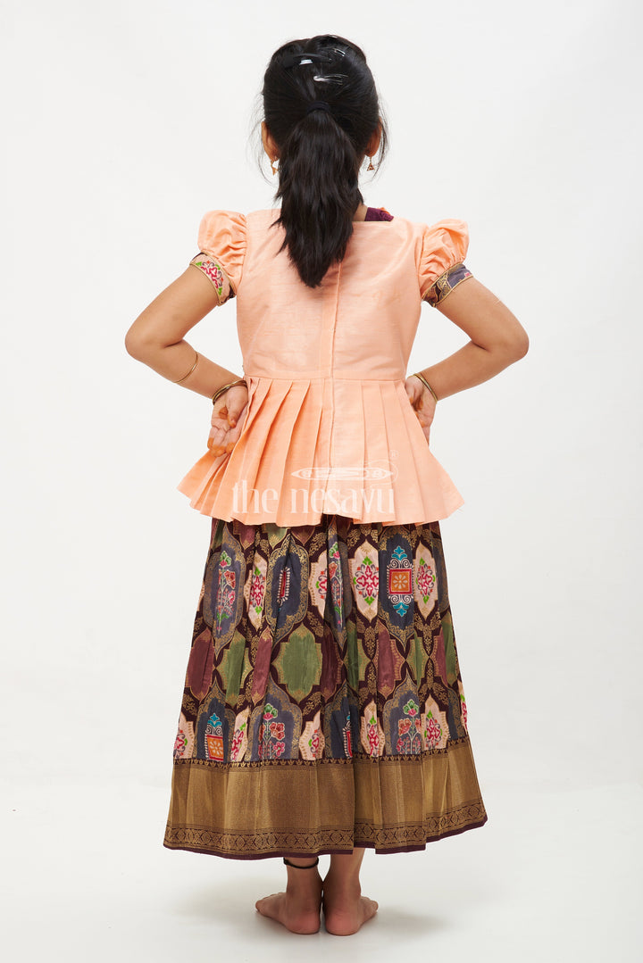 The Nesavu Pattu Pavadai Peach and Green Viscose Silk Peplum Top with Placement Print Skirt for Girls Nesavu