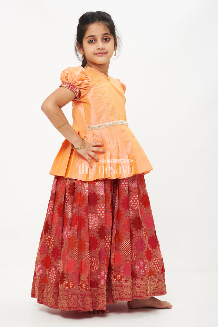 The Nesavu Pattu Pavadai Peach and Pink Viscose Silk Peplum Top with Placement Print Skirt for Girls Nesavu