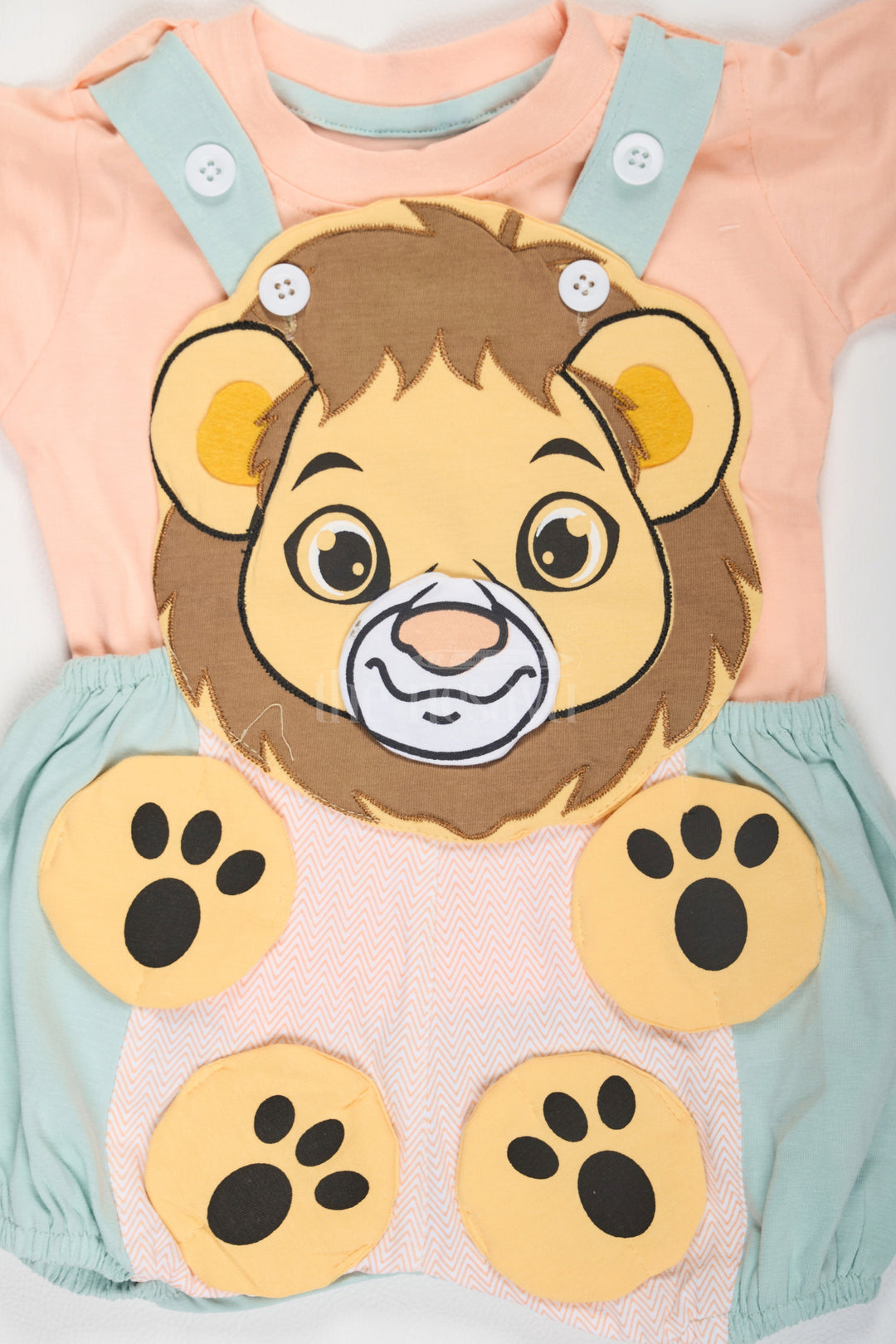 The Nesavu Baby Dungarees Peach Baby Dungaree Set with Lion Face Design for Boys Nesavu Peach Baby Dungaree Set Lion Face Blue Overalls Nesavu Boys Fun Playful Outfit