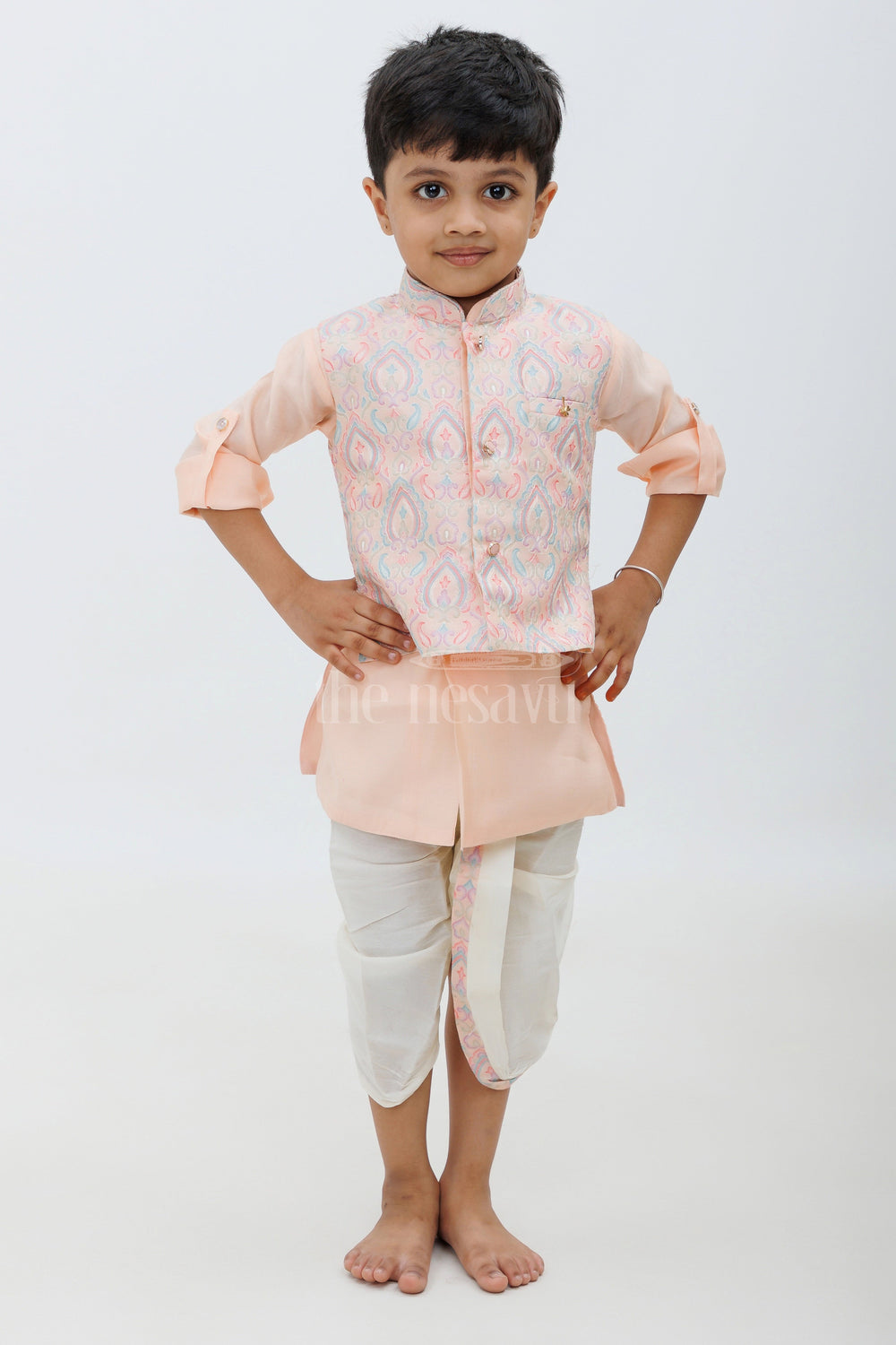 The Nesavu Boys Dothi Set Peach Color Designer Dhoti Kurta Set for Boys with Embroidered Jacket and Panchakacham Pants Nesavu Peach Color Designer Dhoti Kurta Set for Boys with Embroidered Jacket Nesavu
