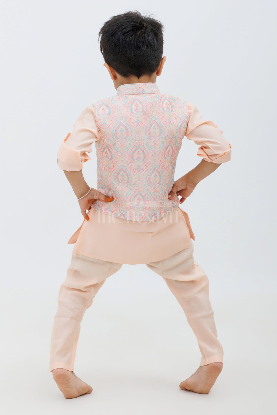 The Nesavu Boys Dothi Set Peach Color Designer Dhoti Kurta Set for Boys with Embroidered Jacket and Panchakacham Pants Nesavu Peach Color Designer Dhoti Kurta Set for Boys with Embroidered Jacket Nesavu