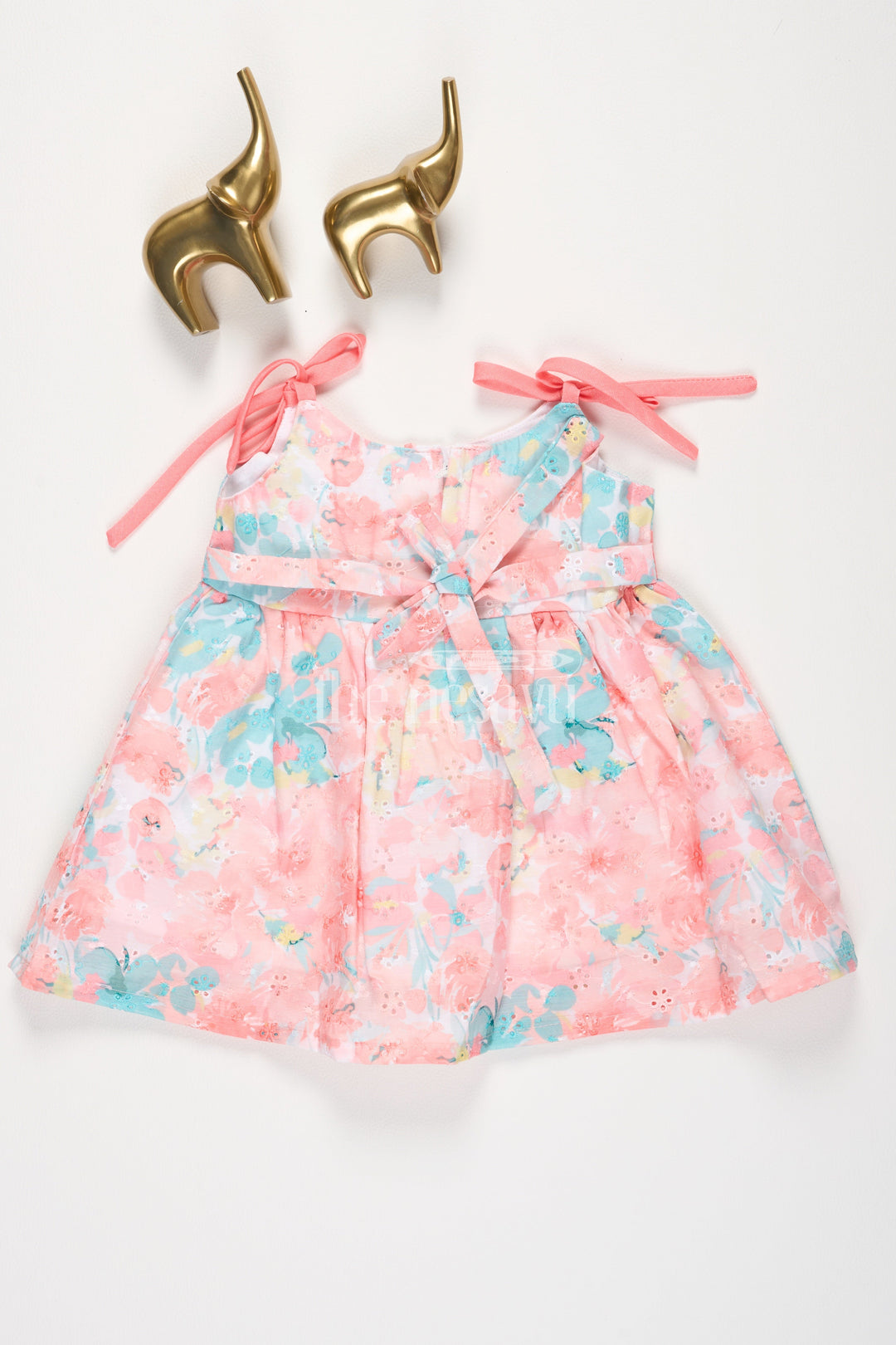 The Nesavu Tie-up Frock Peach Floral Digital Printed TieUp Frock with Bow Detail for Girls Nesavu Peach Floral Digital Printed Tie-Up Frock with Bow Detail for Girls Nesavu