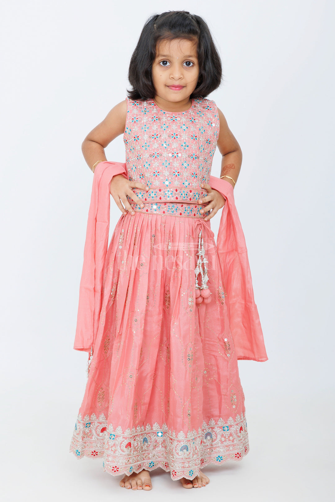 The Nesavu Girls Lehenga Choli Peach Lehenga Choli with Shimmering Sequin Embroidery and Floral Border Detailing Nesavu Nesavu Peach Lehenga Choli Sequin Embroidery Contrasting Floral Border Special Occasions