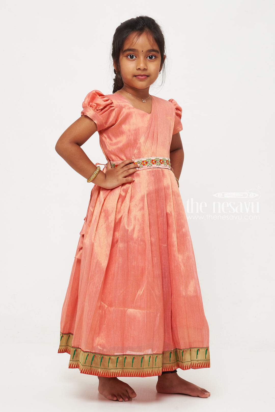 The Nesavu Girls Silk Gown Peach Tissue Fabric Saree Gown for Girls with Embroidered Hip Belt Nesavu