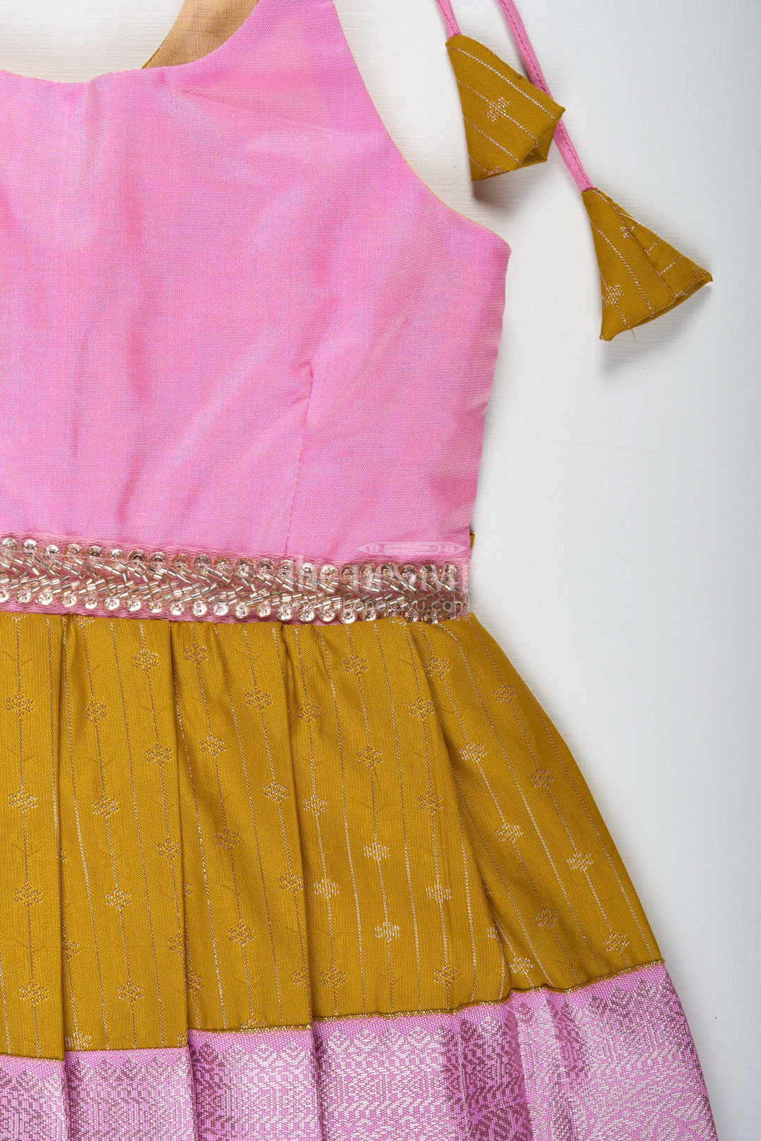 The Nesavu Tie-up Frock Pink and Mustard Frock for Baby Girls in Semi Silk Ideal for Birthdays and Traditional Gatherings Nesavu Nesavu Pink And Mustard Frock For Baby Girls Semi Silk Ethnic Dress For Birthdays And Poojas