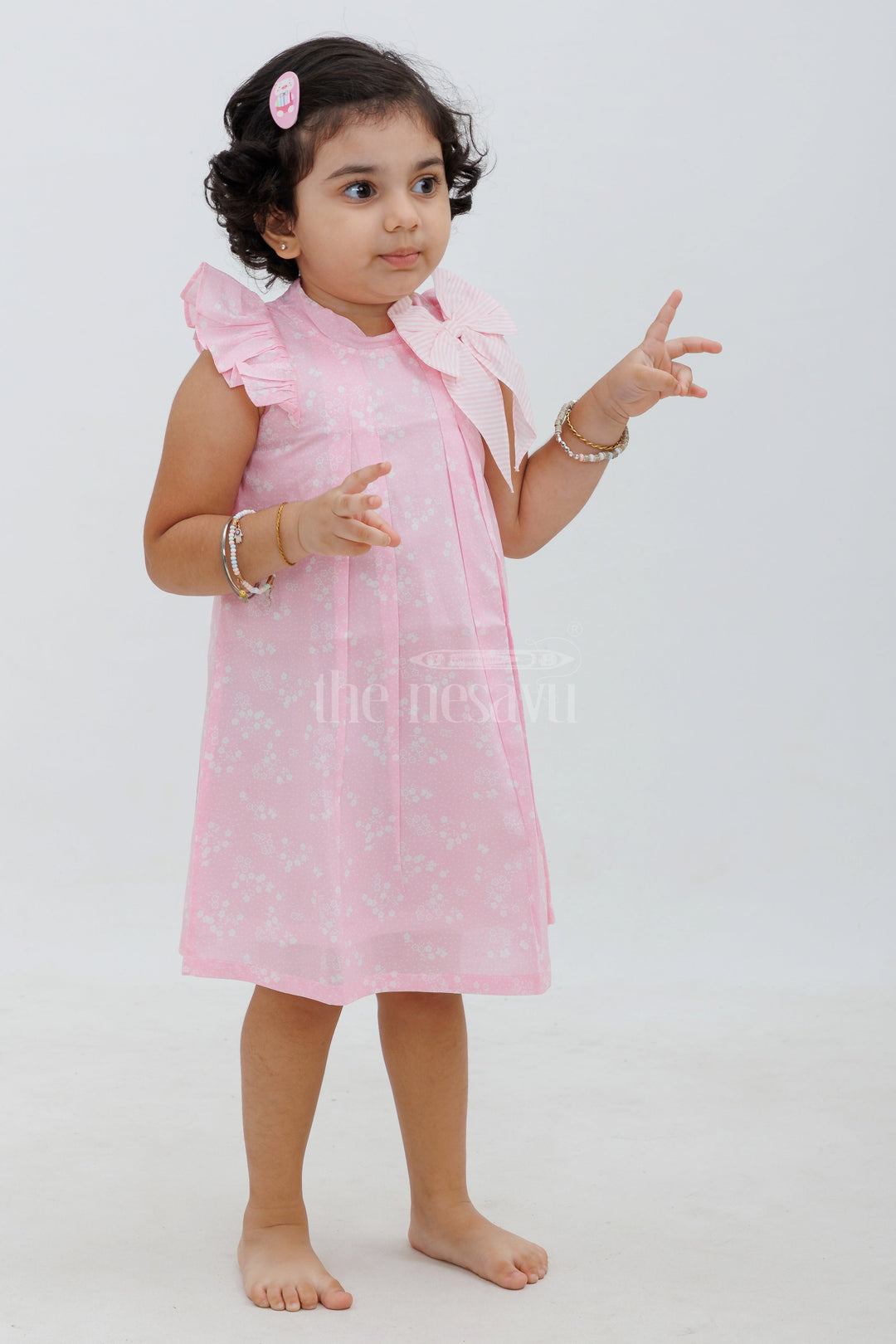 The Nesavu Baby Cotton Frocks Pink Cotton Frock with White Motif and Ruffle Sleeves Nesavu Pink Cotton Frock with White Motif and Ruffle Sleeves - Nesavu