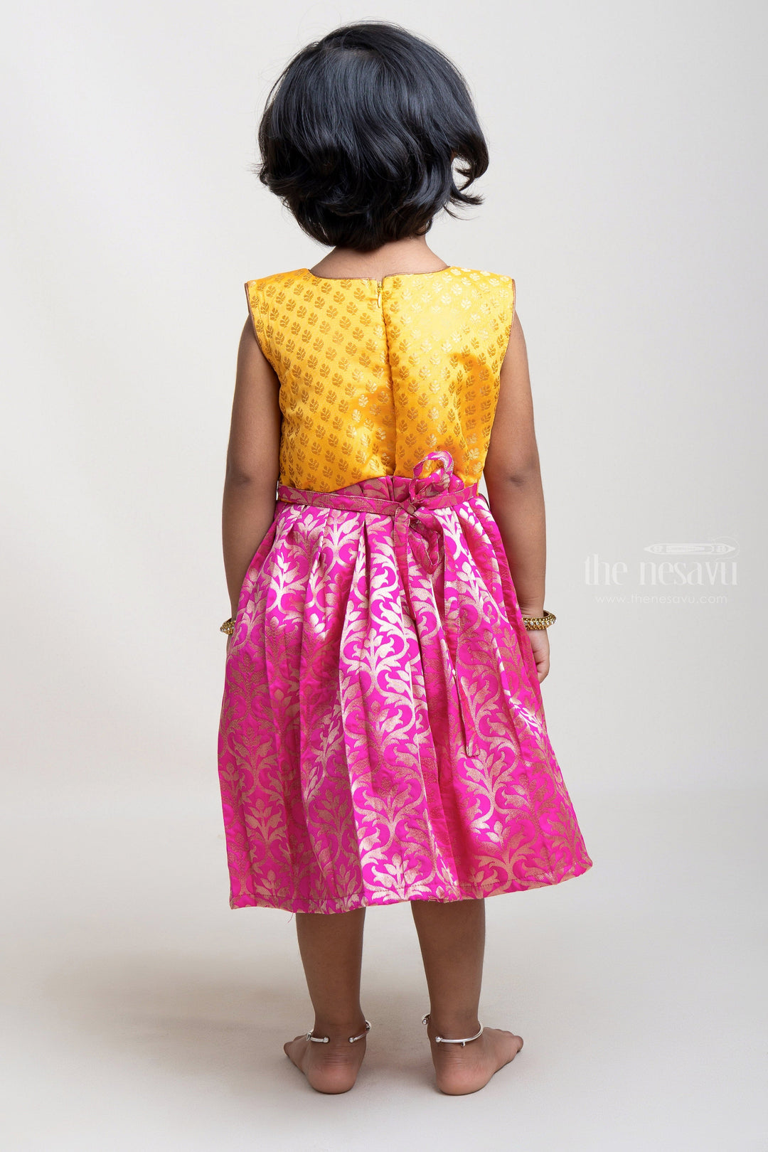 The Nesavu Silk Frock Pink Designer Semi-Silk with Yellow Pleated Yoke Design Frock For Girls Nesavu Stylish Pleated Semi-Silk Frocks for Girls | Premium Silk Frocks | The Nesavu