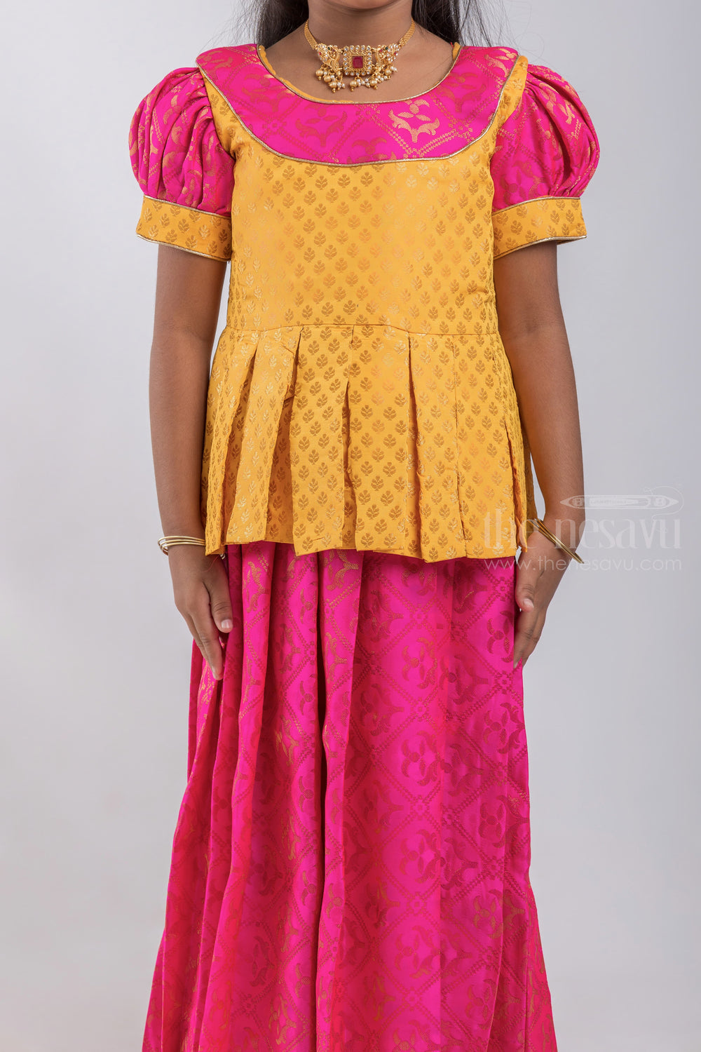The Nesavu Pattu Pavadai Premium Yellow Brocade Designer Pleated Blouse And Pink Floral Designer Silk Skirt For Girls psr silks Nesavu