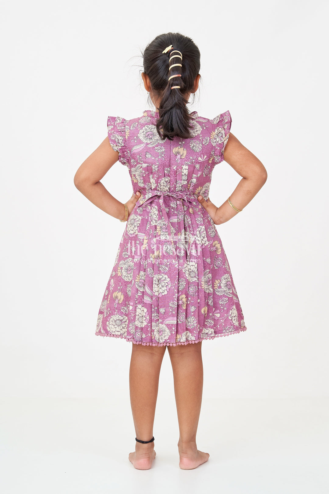 The Nesavu Girls Cotton Frock Princess Short Frock in Mauve Floral Cotton with Ruffled Sleeves and Pleated Detailing Nesavu Princess Short Frock Girls Mauve Floral Cotton Pleats Frilled Sleeves | The Nesavu