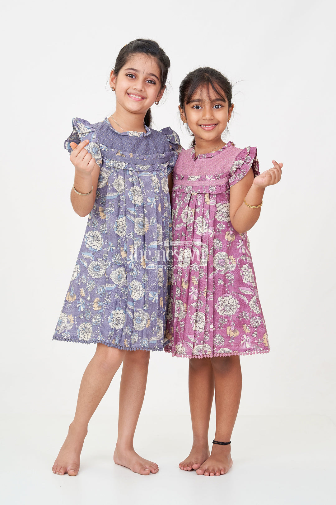 The Nesavu Girls Cotton Frock Princess Short Frock in Mauve Floral Cotton with Ruffled Sleeves and Pleated Detailing Nesavu Princess Short Frock Girls Mauve Floral Cotton Pleats Frilled Sleeves | The Nesavu