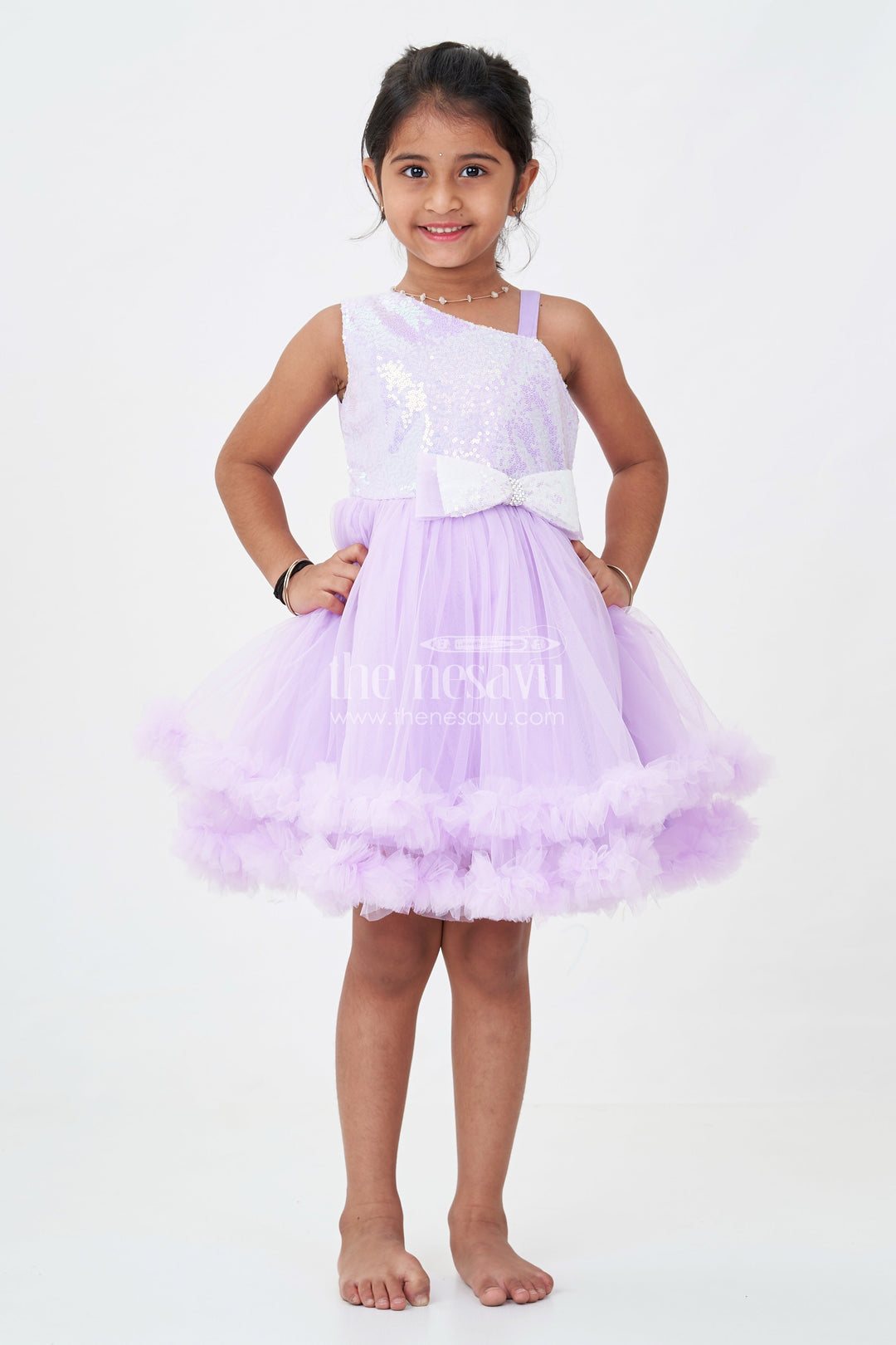 The Nesavu Girls Fancy Party Frock Purple Colour Princess Dress for Girls in Net with Glitter Bow and Shimmering Sequins Nesavu Purple Colour Princess Dress Girls Sequin Bodice Ruffle Tulle Skirt | The Nesavu