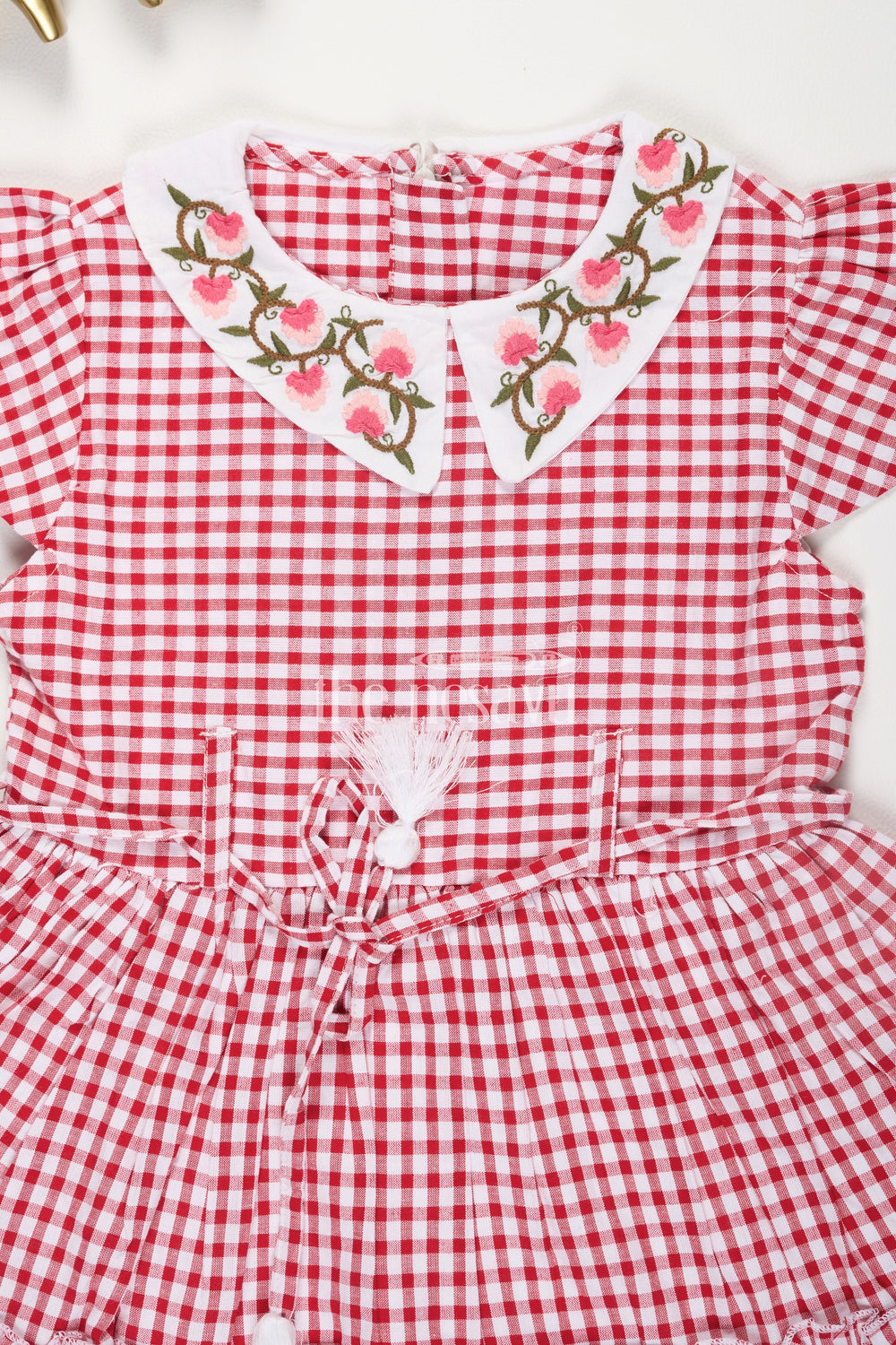 The Nesavu Girls Cotton Frock Red and White Checked Cotton Frock for Girls with Floral Embroidery and Peter Pan Collar Nesavu Red and White Checked Cotton Frock for Girls with Floral Embroidery and Peter Pan Collar Nesavu