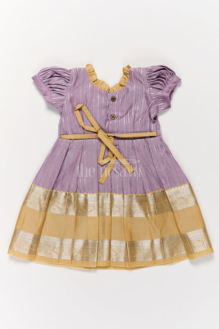 The Nesavu Girls Kanchi Silk Frock Regal Lavender Girls Kanchi Silk Frock with Gleaming Golden Zari Border for Pongal Nesavu Nesavu Lavender Girls Kanchi Silk Frock Zari Work Traditional Pongal Celebrations