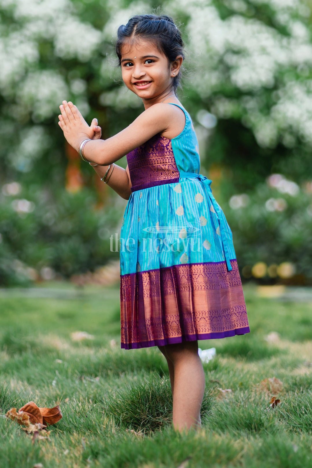 The Nesavu Girls Kanchi Silk Frock Royal Festive Attire for Little Ones: Purple and Green Kanji Border Silk Frock Nesavu Royal Festive Attire for Little Ones: Purple and Green Kanji Border Silk Frock