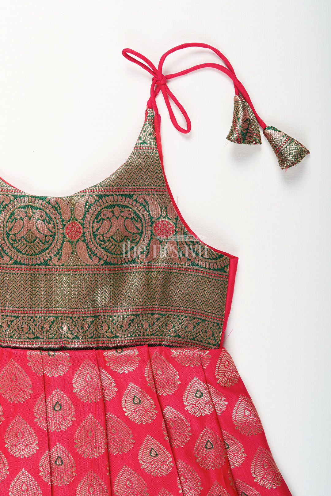 The Nesavu Tie-up Frock Semi Banaras Silk Tie-Up Frock for Baby Girl Green and Red Ethnic Dress Nesavu Nesavu semi Banaras silk frock for baby girl – red and green ethnic tie-up dress for celebrations