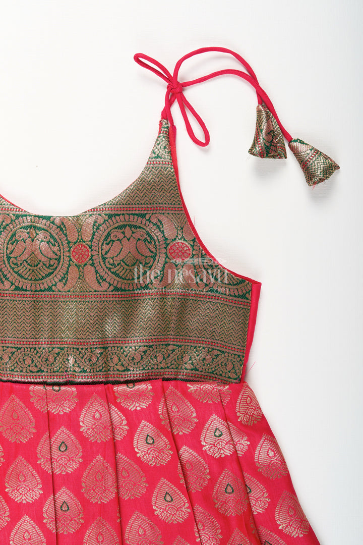 The Nesavu Tie-up Frock Semi Banaras Silk Tie-Up Frock for Baby Girl Green and Red Ethnic Dress Nesavu Nesavu semi Banaras silk frock for baby girl – red and green ethnic tie-up dress for celebrations