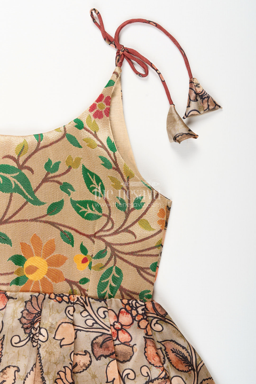 The Nesavu Tie-up Frock Silk Blend Kalamkari Tie-Up Frock for Baby Girls with Peacock Border Nesavu Nesavu Kalamkari silk blend tie-up frock for baby girls – peacock motif festive dress