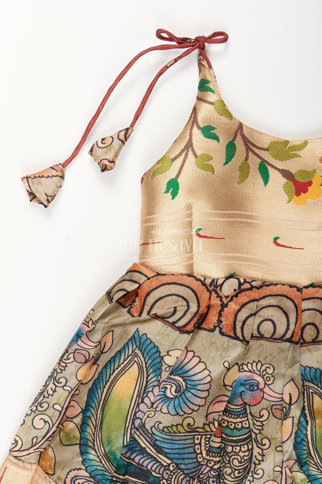 The Nesavu Tie-up Frock Silk Blend Kalamkari Tie-Up Frock for Baby Girls with Peacock Border Nesavu Nesavu Kalamkari silk blend tie-up frock for baby girls – peacock motif festive dress
