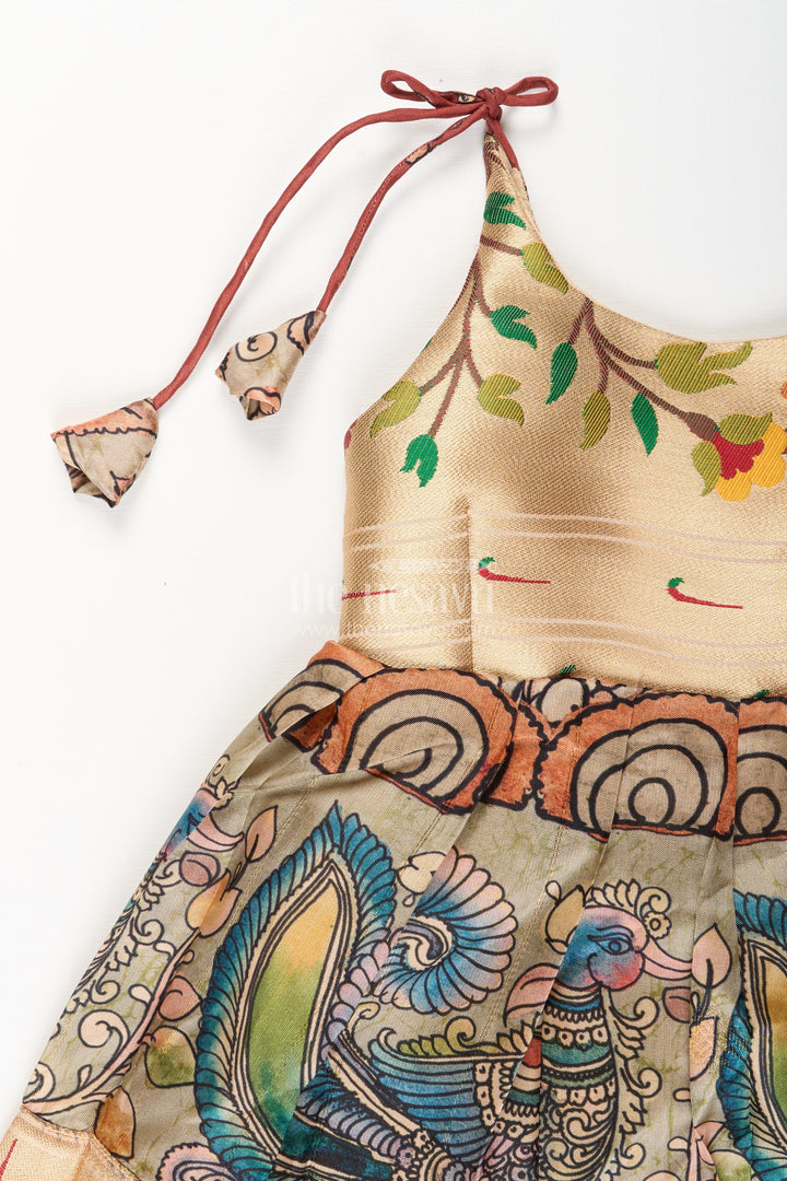 The Nesavu Tie-up Frock Silk Blend Kalamkari Tie-Up Frock for Baby Girls with Peacock Border Nesavu Nesavu Kalamkari silk blend tie-up frock for baby girls – peacock motif festive dress
