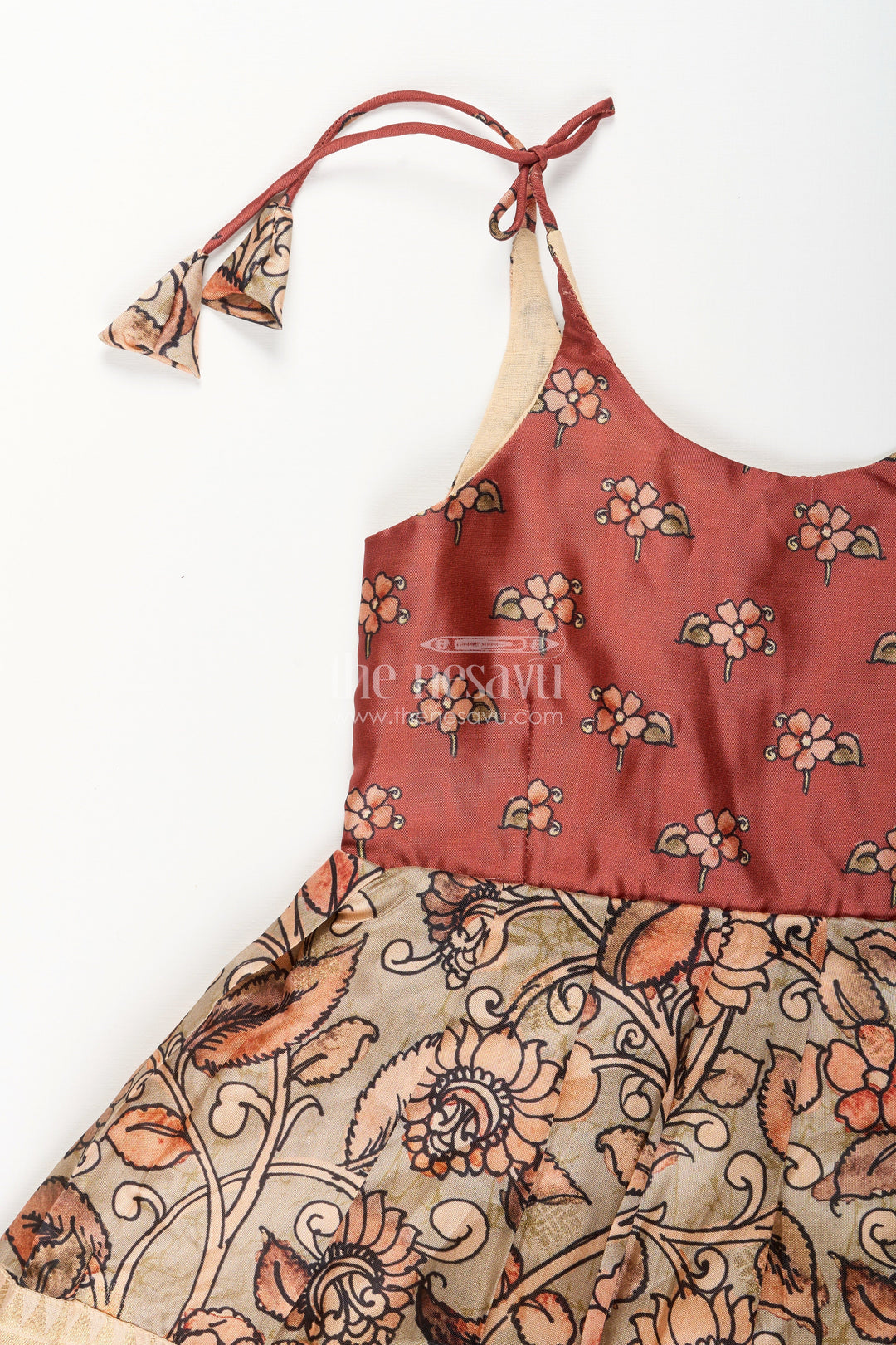 The Nesavu Tie-up Frock Silk Blend Kalamkari Tie-Up Frock for Baby Girls with Peacock Border Nesavu Nesavu Kalamkari silk blend tie-up frock for baby girls – peacock motif festive dress
