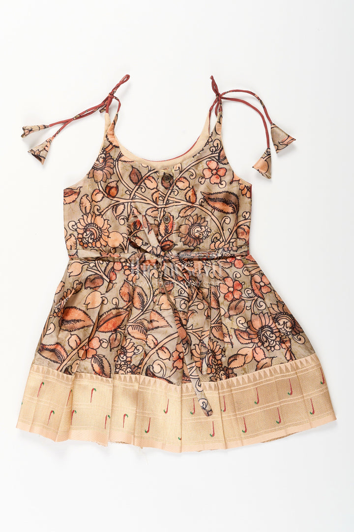 The Nesavu Tie-up Frock Silk Blend Kalamkari Tie-Up Frock for Baby Girls with Peacock Border Nesavu Nesavu Kalamkari silk blend tie-up frock for baby girls – peacock motif festive dress