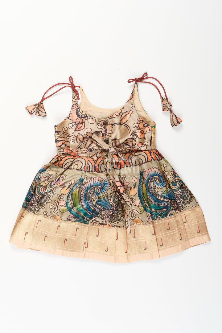 The Nesavu Tie-up Frock Silk Blend Kalamkari Tie-Up Frock for Baby Girls with Peacock Border Nesavu Nesavu Kalamkari silk blend tie-up frock for baby girls – peacock motif festive dress
