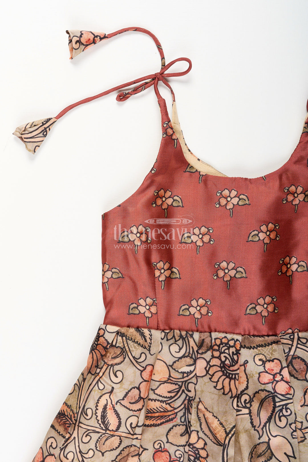 The Nesavu Tie-up Frock Silk Blend Kalamkari Tie-Up Frock for Baby Girls with Peacock Border Nesavu Nesavu Kalamkari silk blend tie-up frock for baby girls – peacock motif festive dress