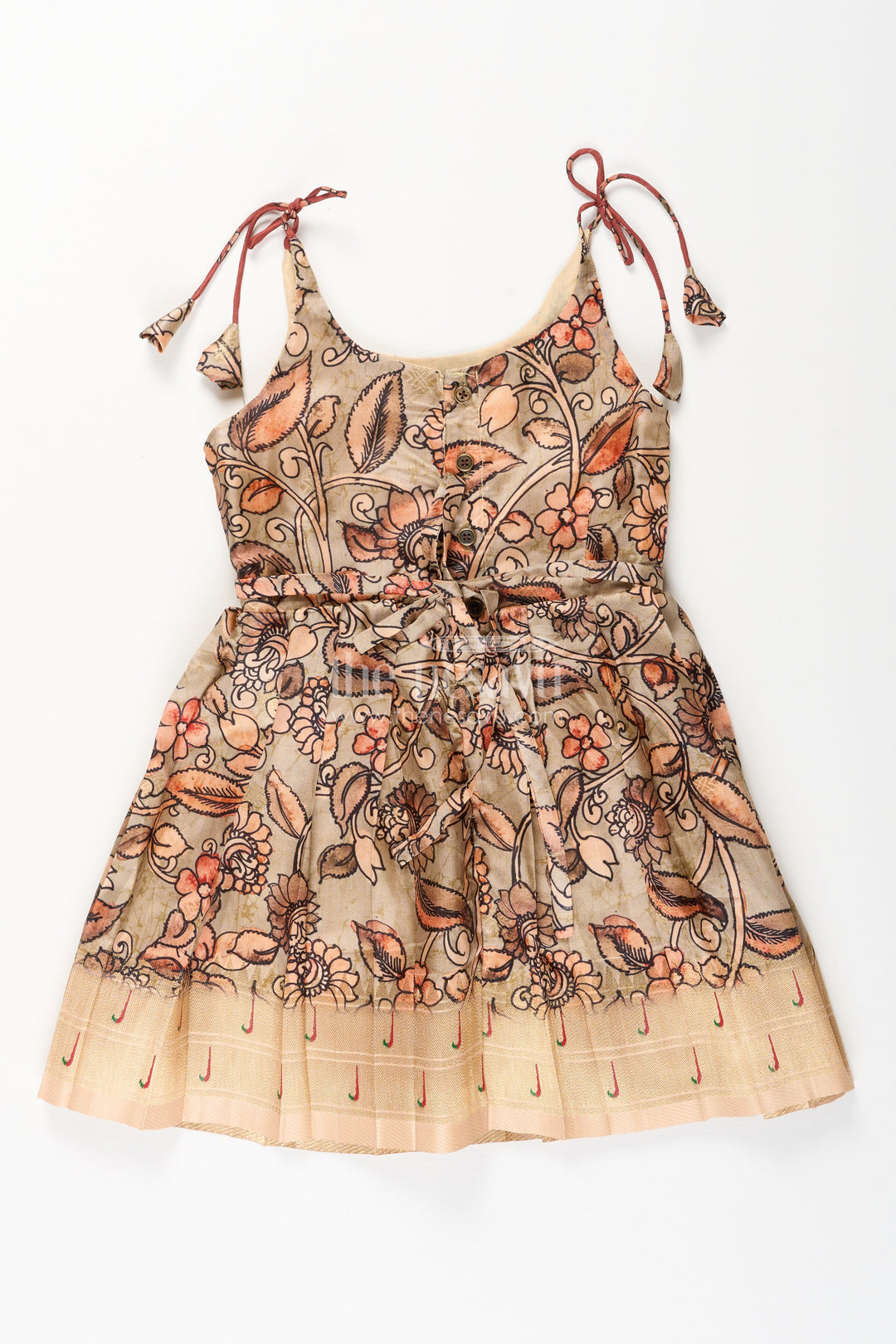 The Nesavu Tie-up Frock Silk Blend Kalamkari Tie-Up Frock for Baby Girls with Peacock Border Nesavu Nesavu Kalamkari silk blend tie-up frock for baby girls – peacock motif festive dress