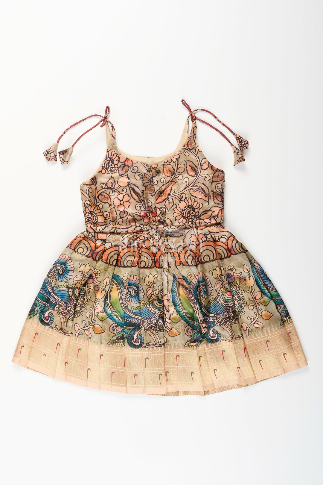 The Nesavu Tie-up Frock Silk Blend Kalamkari Tie-Up Frock for Baby Girls with Peacock Border Nesavu Nesavu Kalamkari silk blend tie-up frock for baby girls – peacock motif festive dress