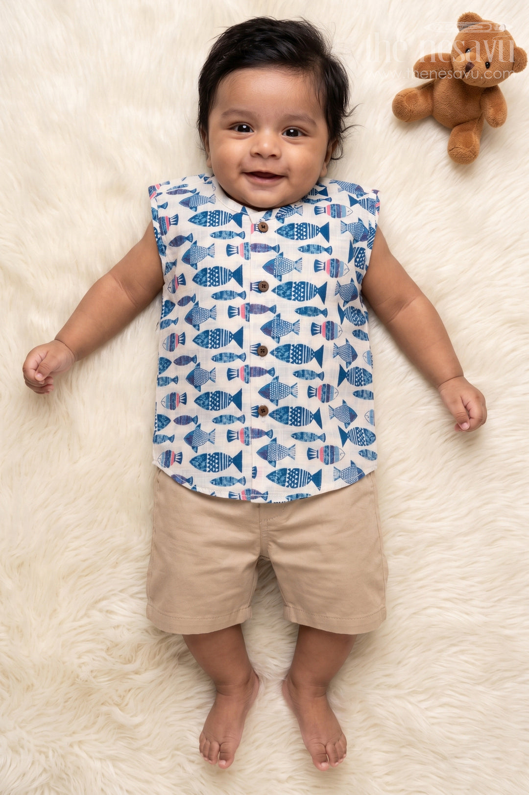 The Nesavu Baby Jablas Sleeveless Baby Jabla with Fish Print for Summer Comfort Nesavu 10 (NB) / Blue / Cotton IF049D-10 Nesavu sleeveless cotton jabla for babies with fun fish print and wooden button closure