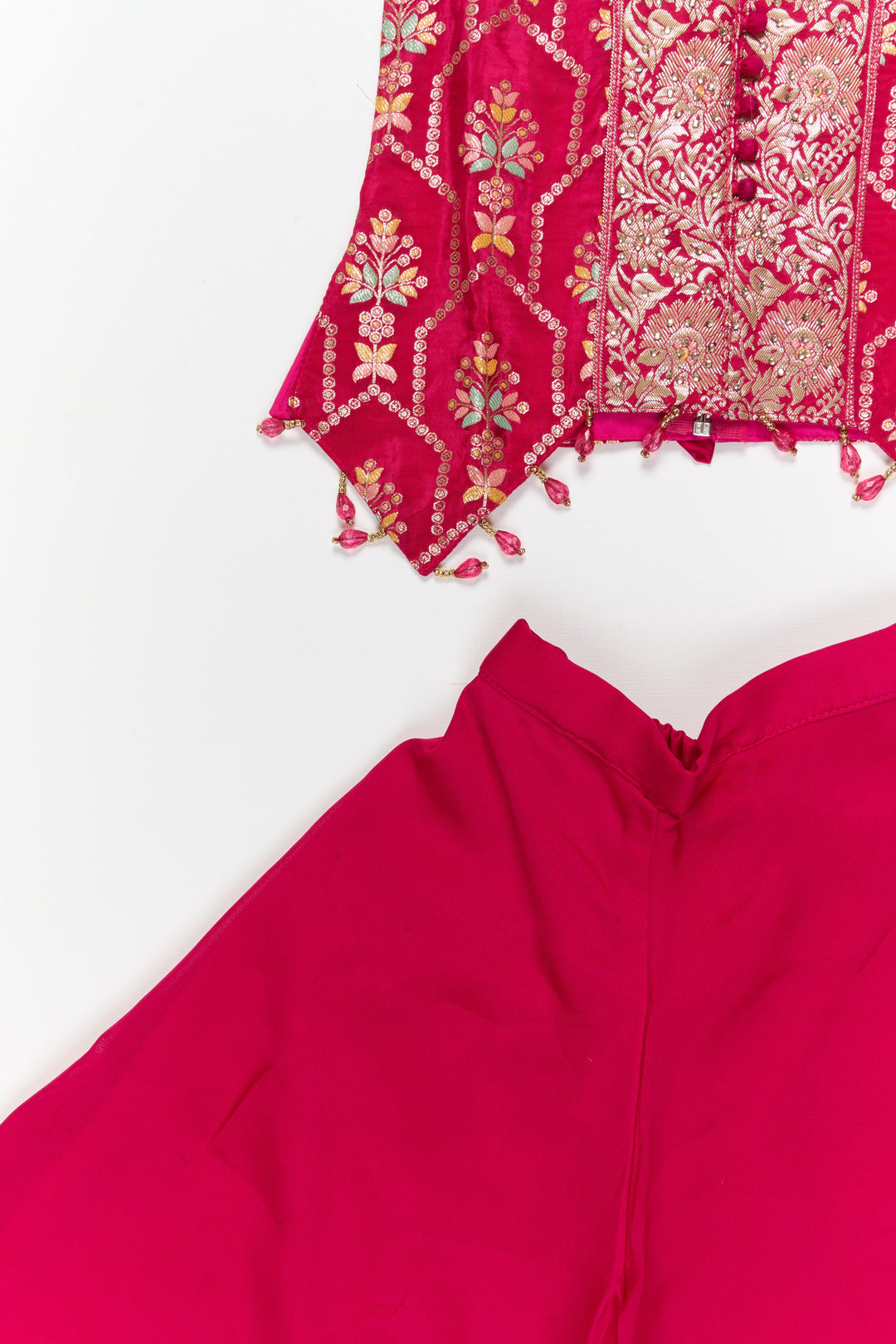 The Nesavu Girls Sharara / Plazo Set Sleeveless Plazo Set for Girls with Festive Embroidery and Tassel Detailing Nesavu Nesavu sleeveless plazo set for girls with embroidered yoke and festive tassel trims – perfect for birthday and temple events