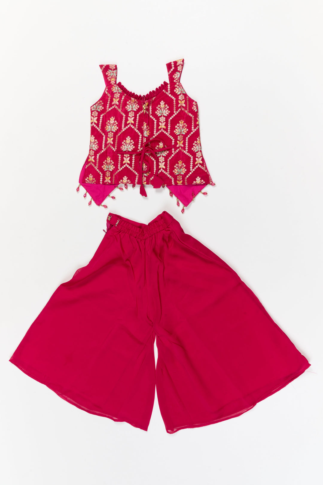 The Nesavu Girls Sharara / Plazo Set Sleeveless Plazo Set for Girls with Festive Embroidery and Tassel Detailing Nesavu Nesavu sleeveless plazo set for girls with embroidered yoke and festive tassel trims – perfect for birthday and temple events