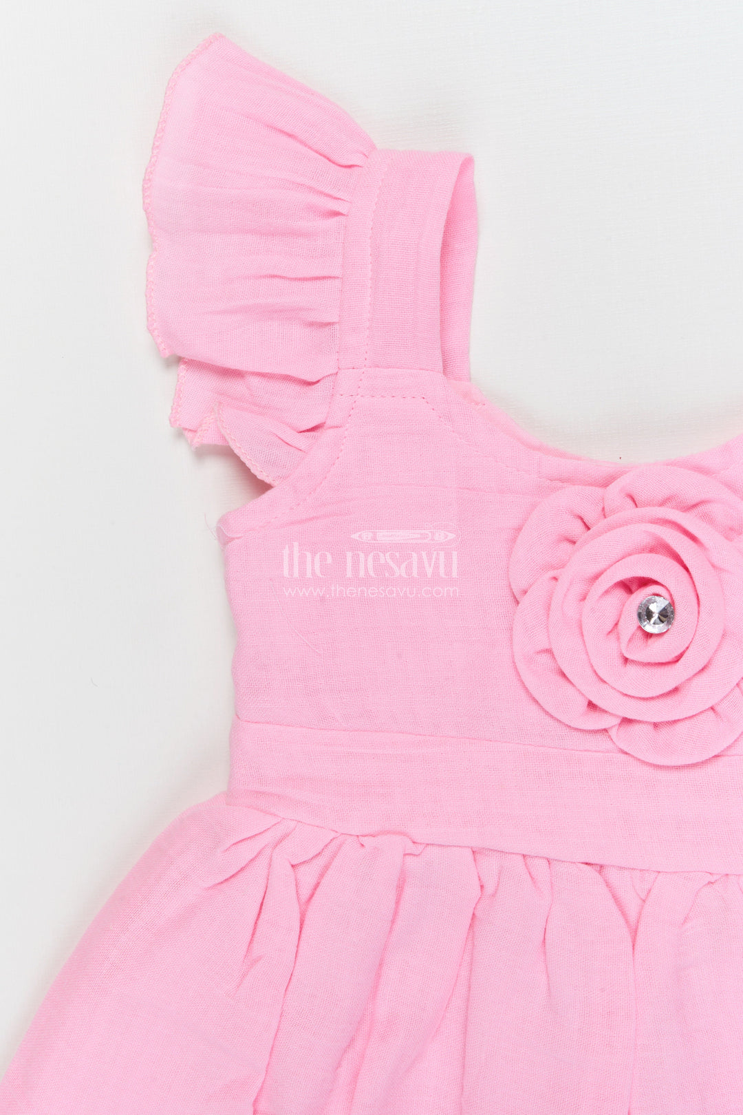 The Nesavu Girls Cotton Frock Soft Cotton Frock for Baby Girls’ Playful Outings Nesavu Nesavu baby girl cotton frock with rosette detail and flutter sleeves for casual wear