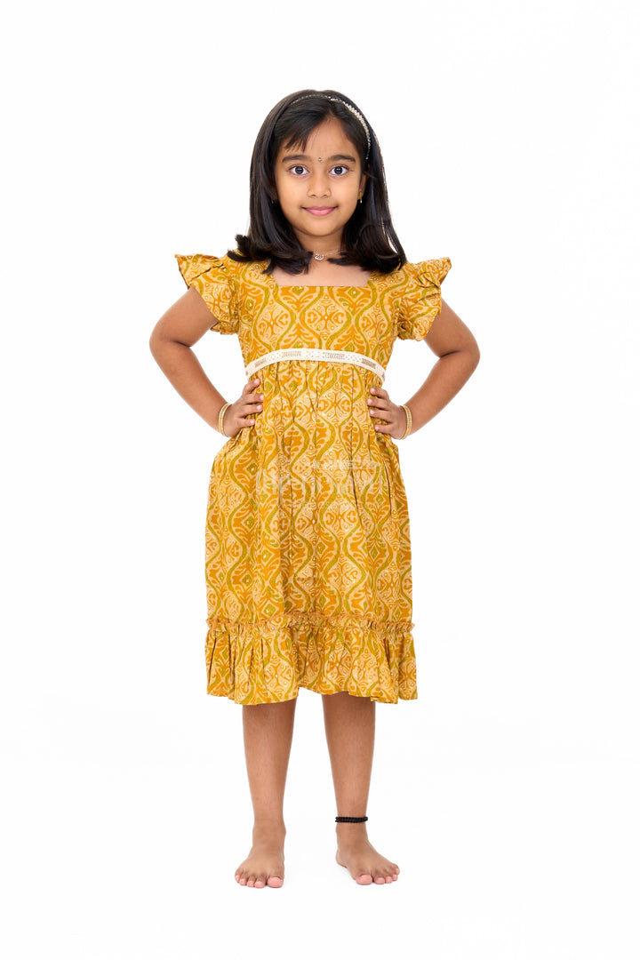 The Nesavu Girls Cotton Frock Solid Cotton Dress for Girls in Mustard with Ruffle and Lace Details Nesavu Solid Cotton Dress Girls Lace Waistband Ruffle Hem Mustard | The Nesavu