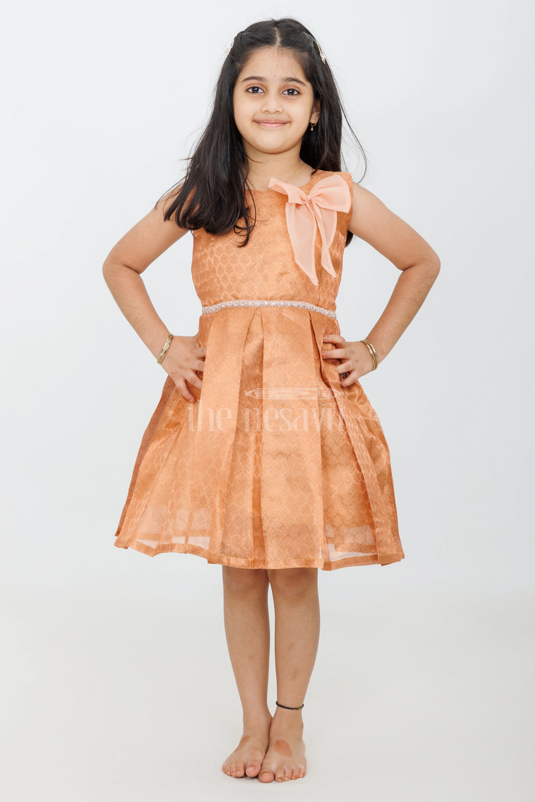 The Nesavu Silk Frock Stunning Girls Raw Silk Frock in Copper Tissue with Pleated Design and Bow Accent Nesavu Nesavu Girls Raw Silk Frock Copper Tissue Elegant Pleats Bow  Ideal Weddings Festive Celebrations